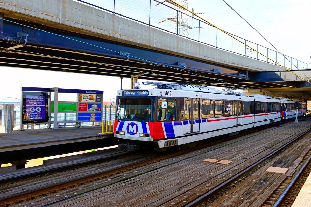 MetroLink light rail system stopped at a station in St.Louis, MO. 