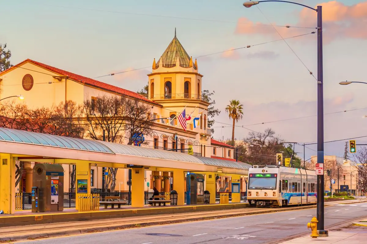 Valley Transportation Authority (VTA) light rail train with the downtown San Jose skyline in Silicon Valley, California