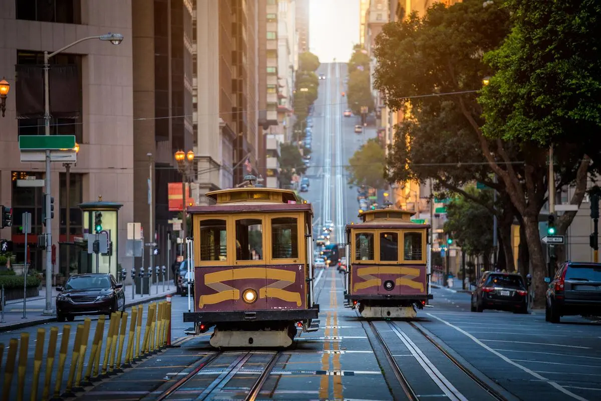 Historic San Francisco cable car on California Street at sunrise in San Francisco, California