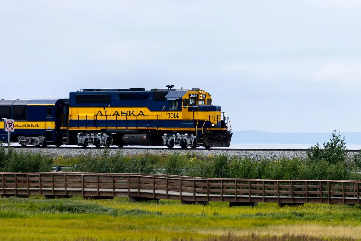 Alaska Railroad locomotive traveling north along Turnagain Arm near Anchorage, Alaska
