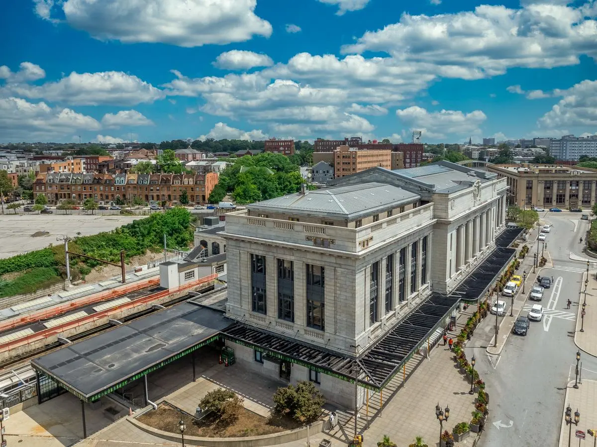 Aerial view of Baltimore Penn Station, a historic Beaux-Arts rail station with passenger platforms in Baltimore, Maryland