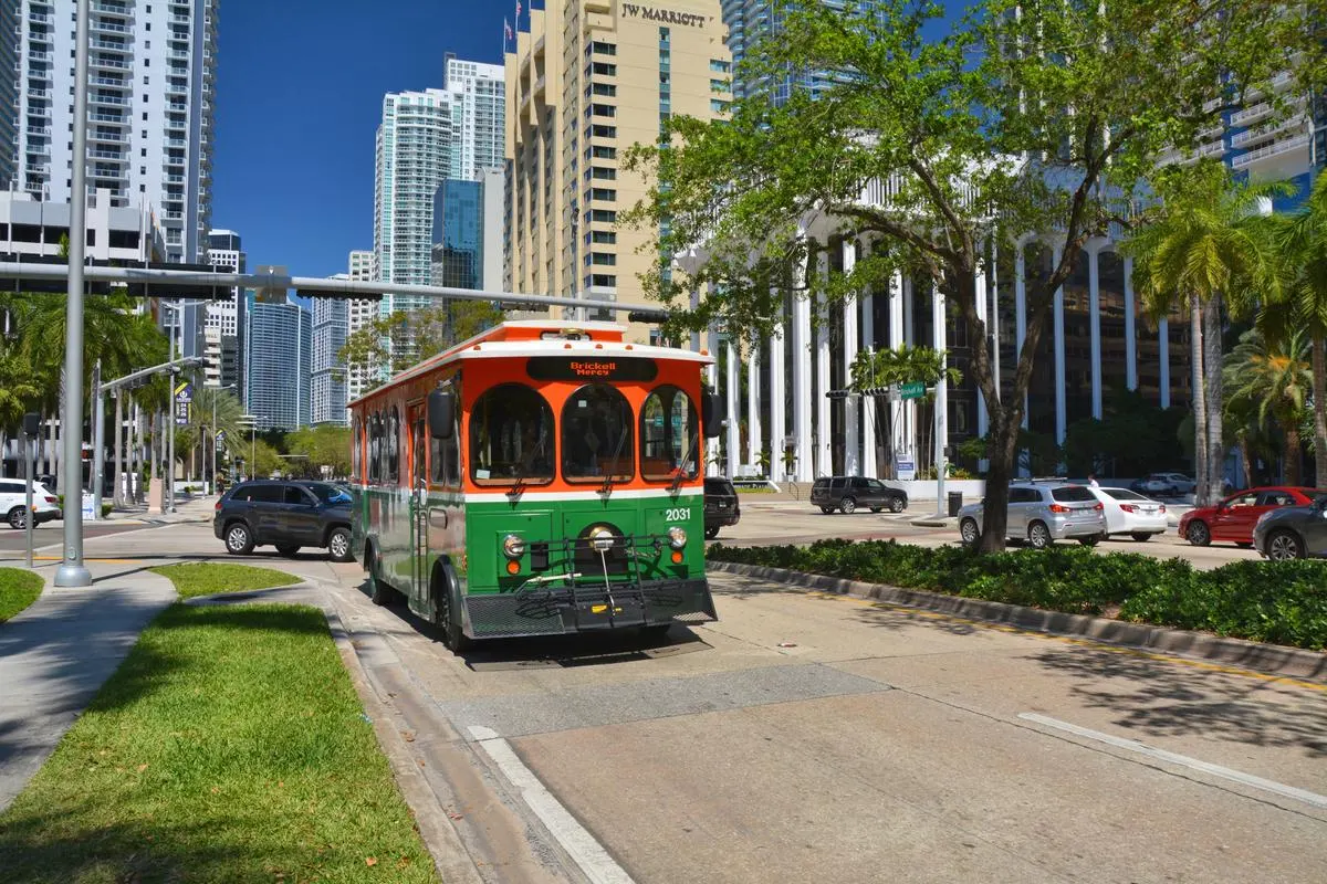 Green trolley on a street in downtown Miami, Florida